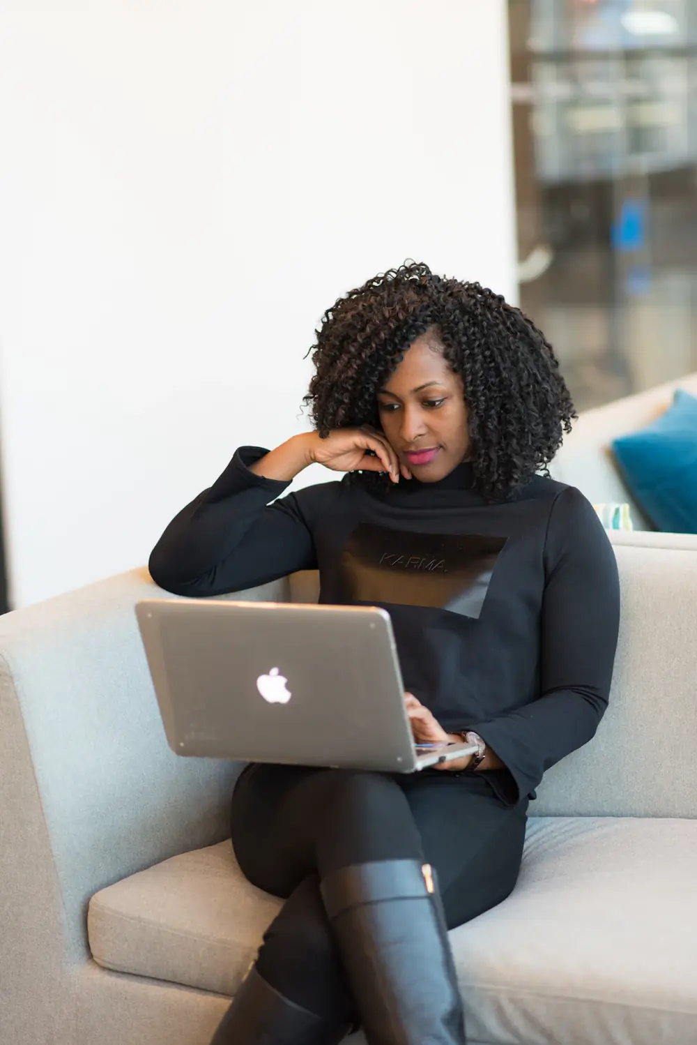 Business owner checking her accounts on a laptop