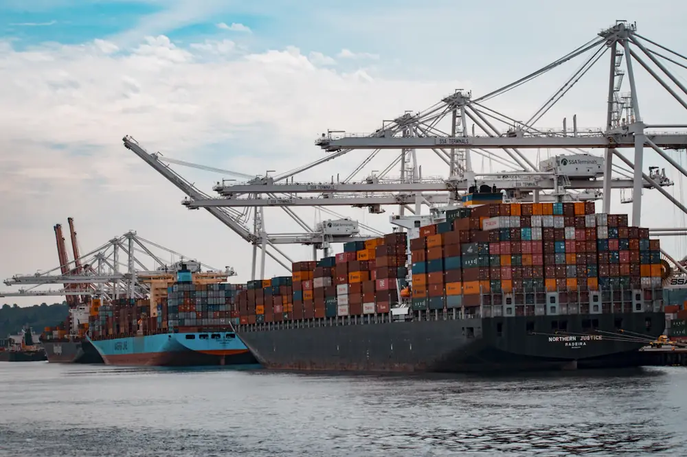 Container ship docked at a busy port